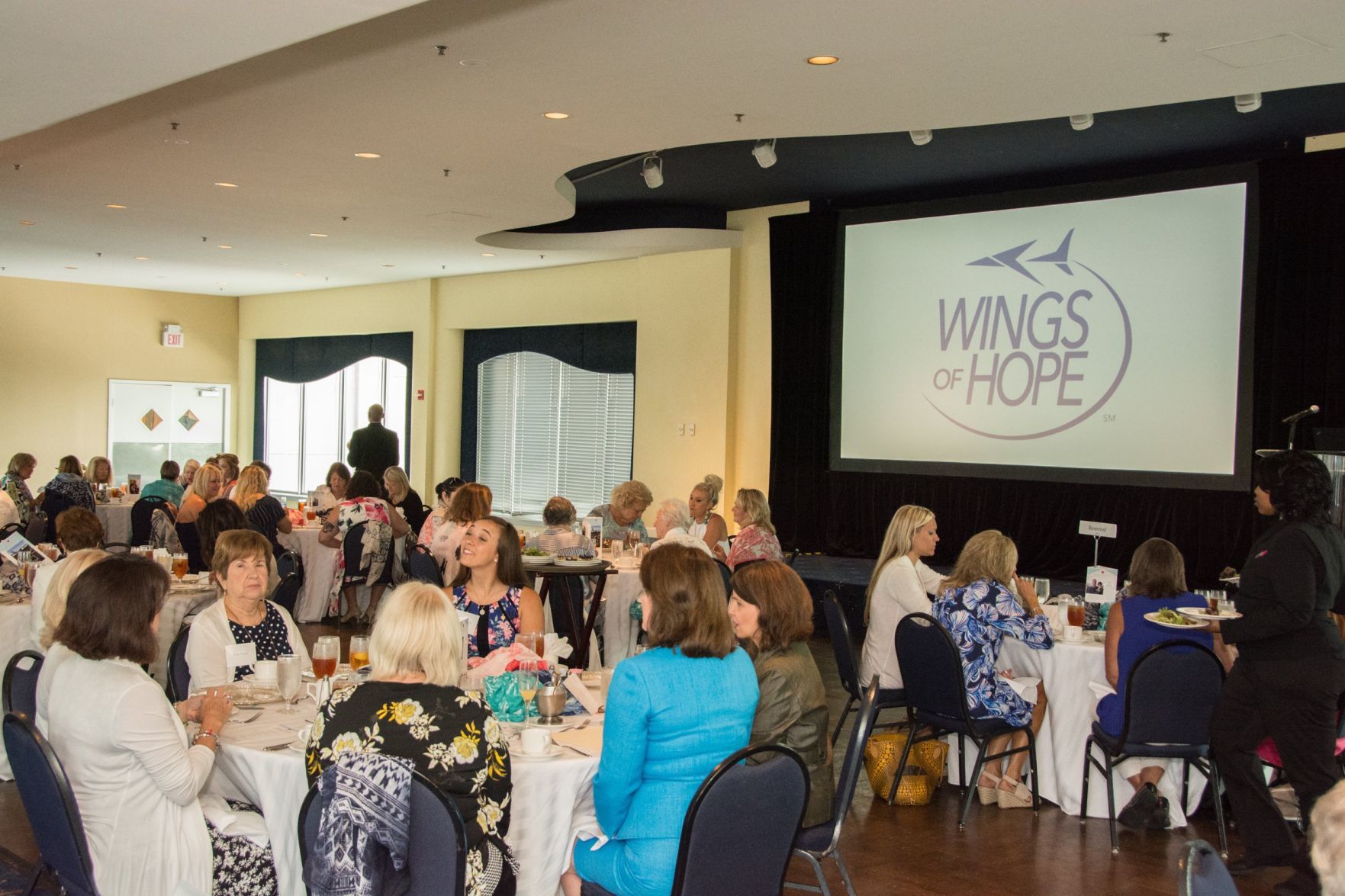 Guests chat and enjoy lunch during the Wings of Hope Ladies Luncheon